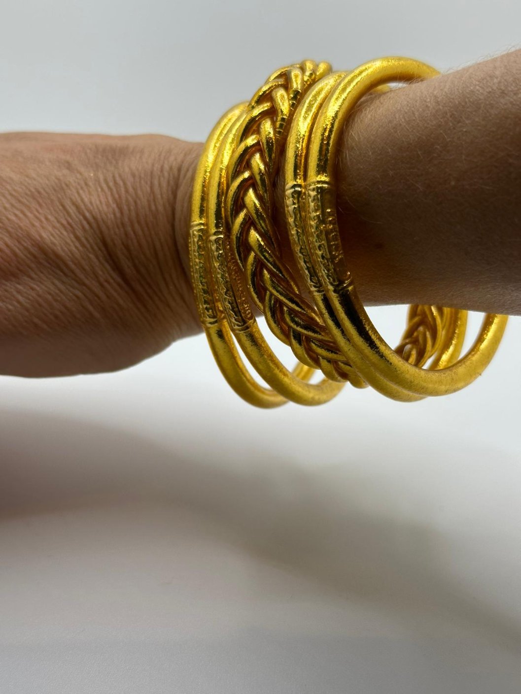 Golden braided Buddhist bracelet